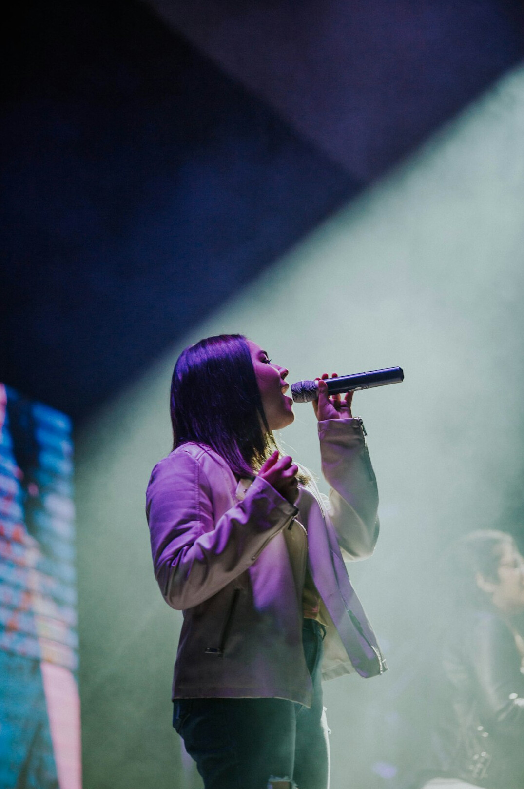 singer performing live on stage